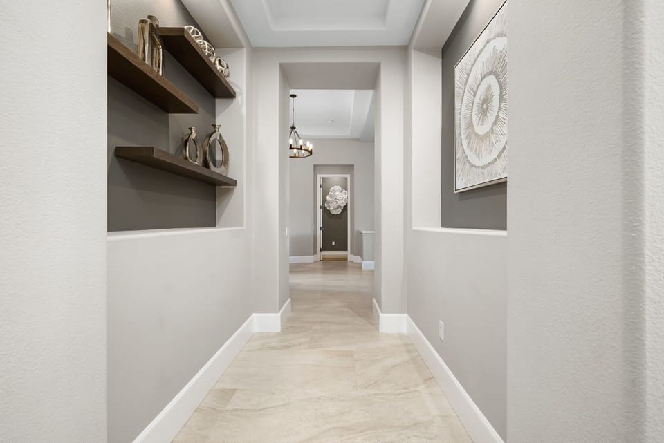 Hallway separating master suite and two en suite guest rooms