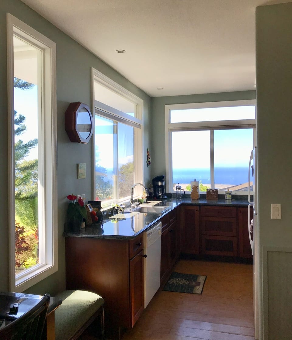 Ocean view from fully equipped kitchen with full size refrigerator and stove.