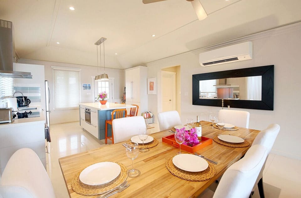 Large dining table with seating for 6. High Chair available on request.