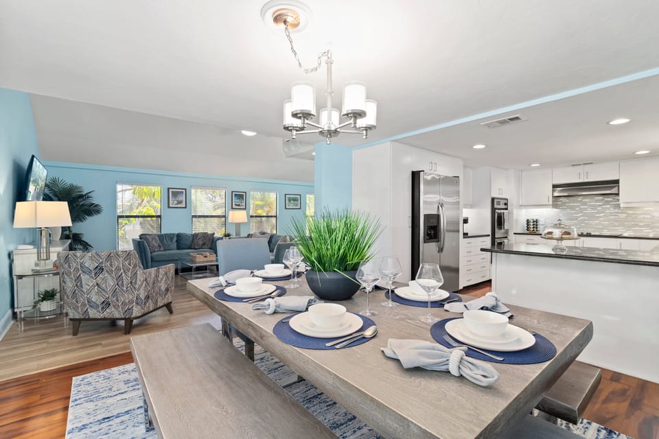 Main living area showing the indoor dining table, kitchen and living room.