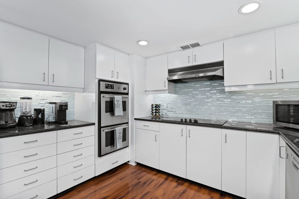 Kitchen with modern appliances and ample work space.