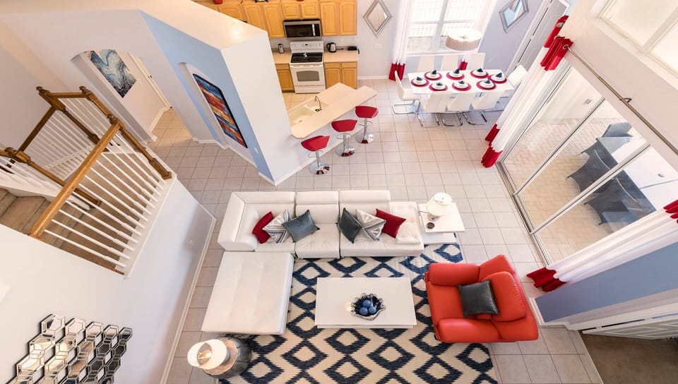 Sunshine & relaxation! This open-plan living room is bathed in natural light & comfy seating.