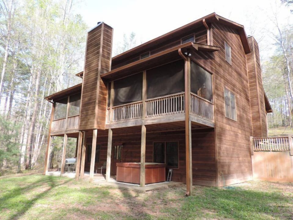 Lower Back Deck off the Game Room with Hot Tub Patio Table and Chairs