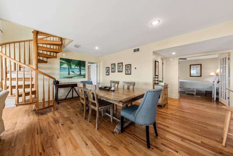 The primary bedrrom is off the main living space and the spiral staircase takes you to the second floor bedrooms