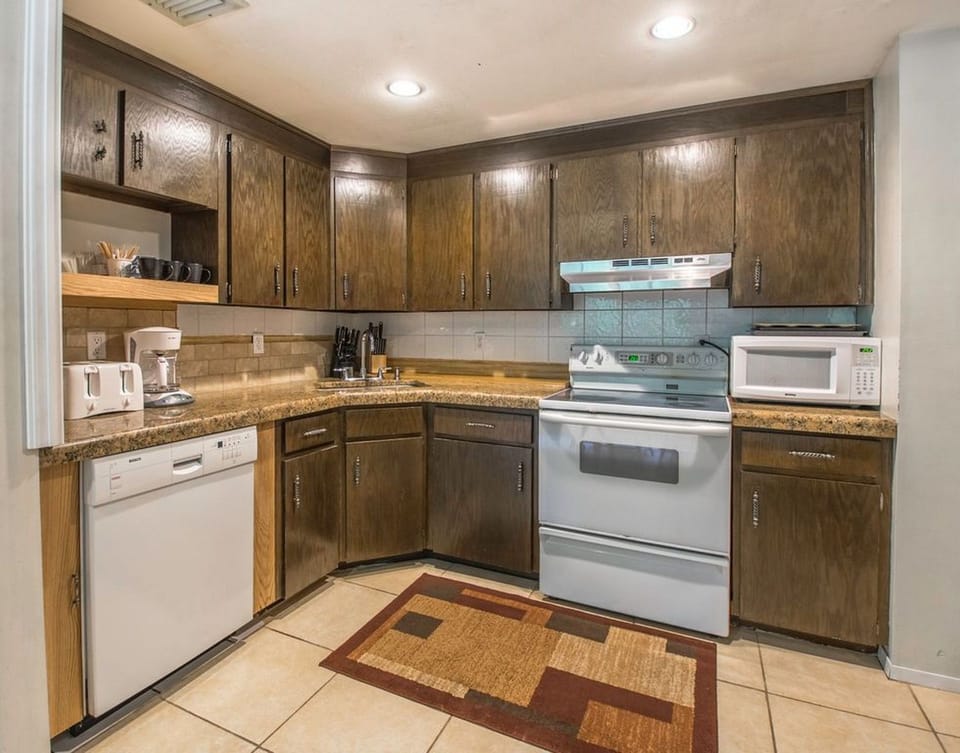 ... tastefully designed, granite counter-top cooking areas opening to ..