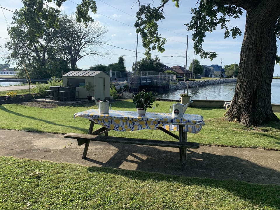 Picnic table out front to have lunch by the water!