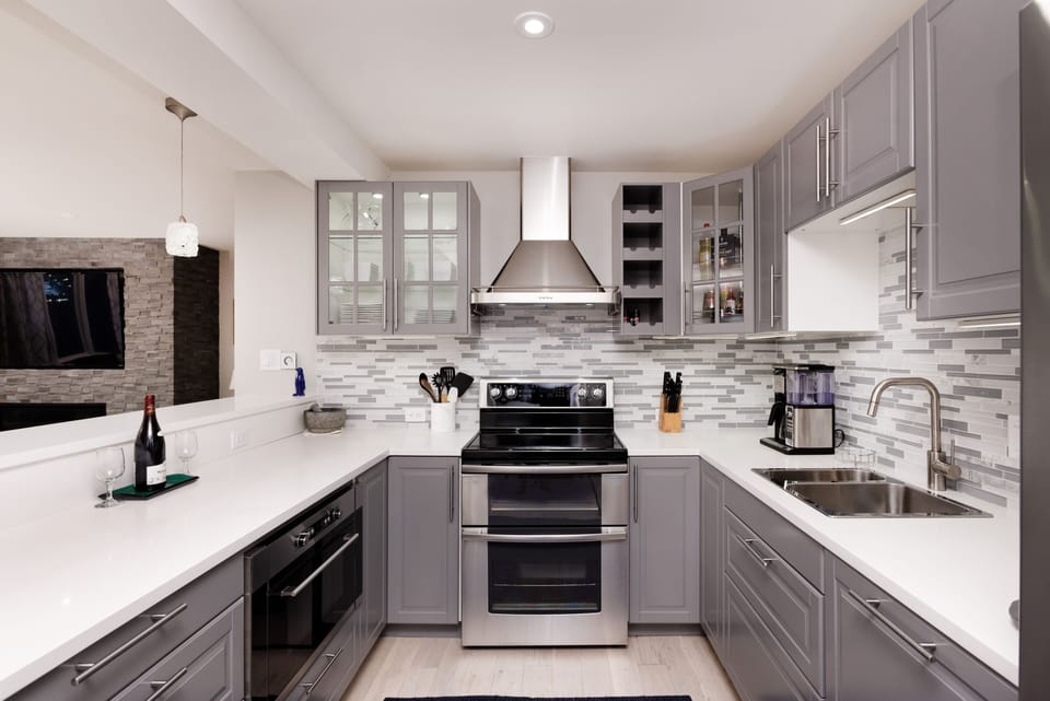 Brand new kitchen with double sink, dishwasher, quartz counters & coffee maker