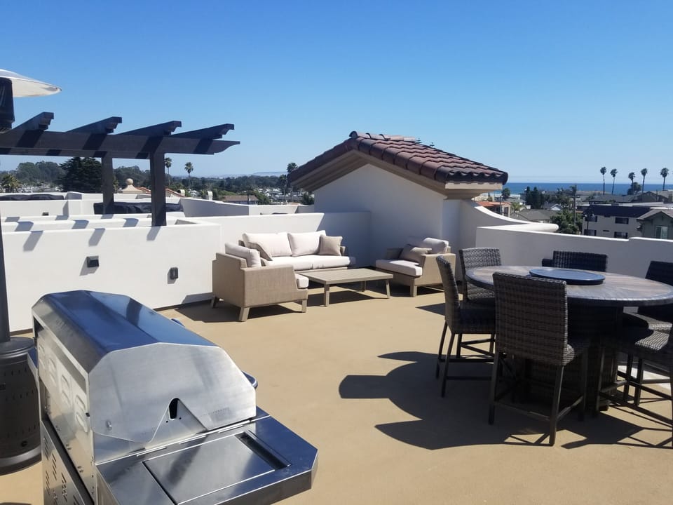 Rooftop Deck has a large 6 burner Stainless Steel BBQ and enough seating for 10