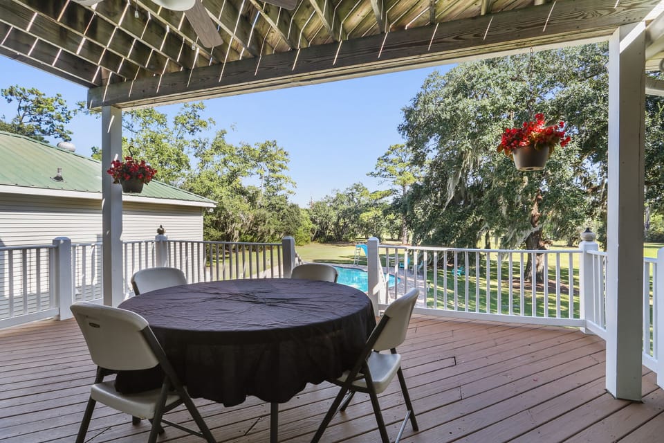 rear porch with view of grounds