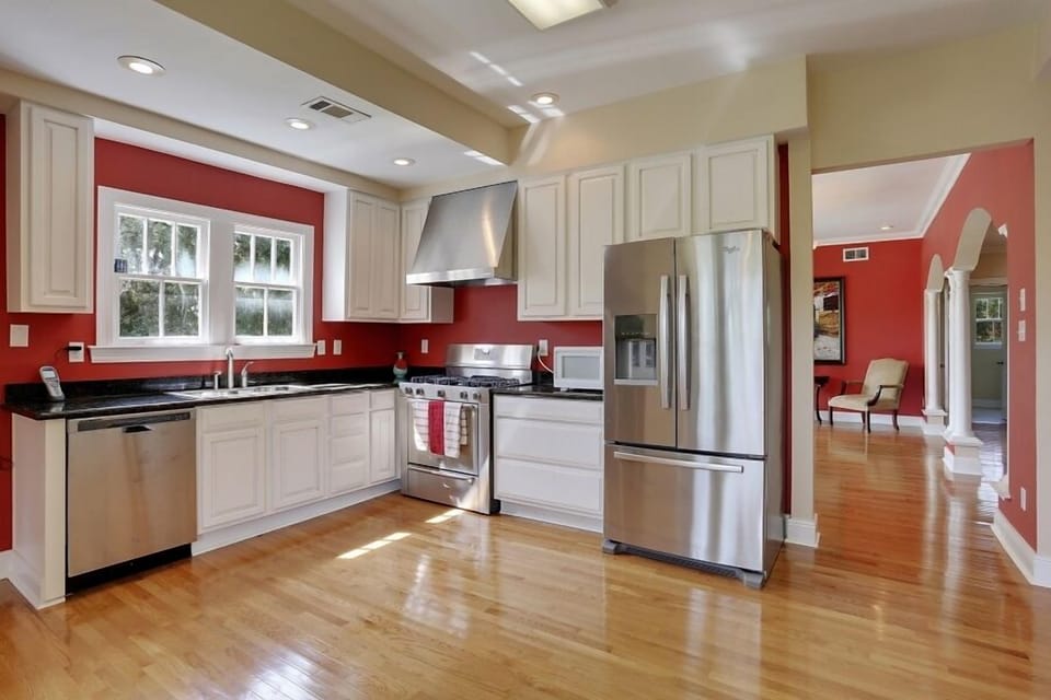 kitchen w granite and stainless appliances.