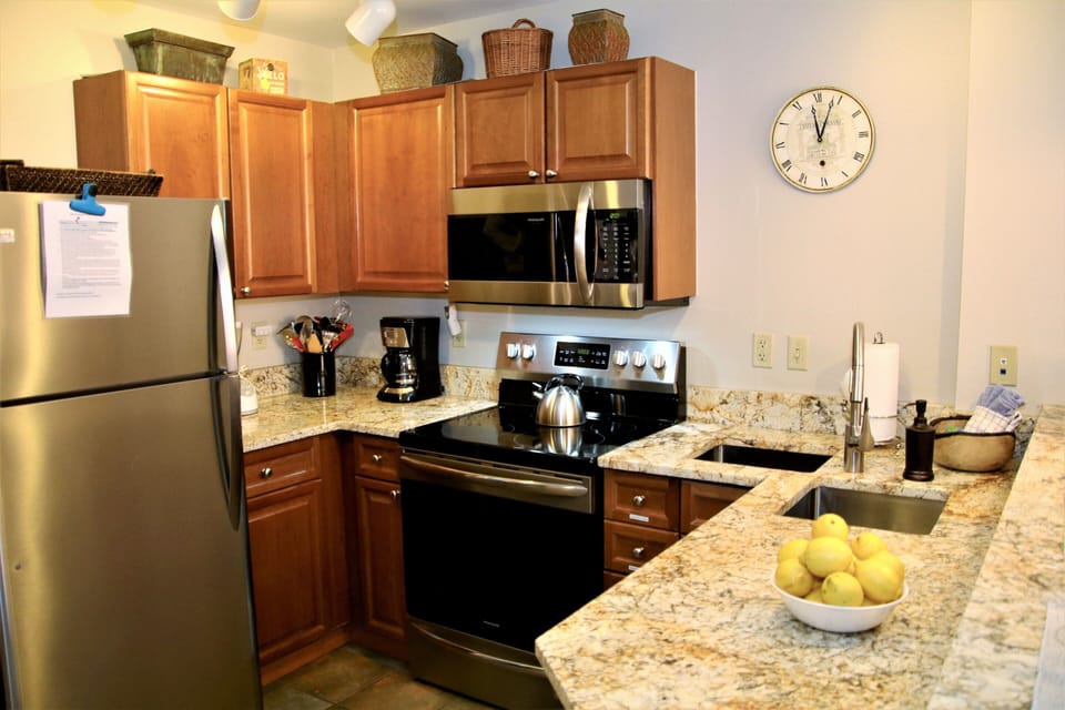 Fully equipped kitchen with crockpot, electric tea kettle, pot/pans, plates, etc