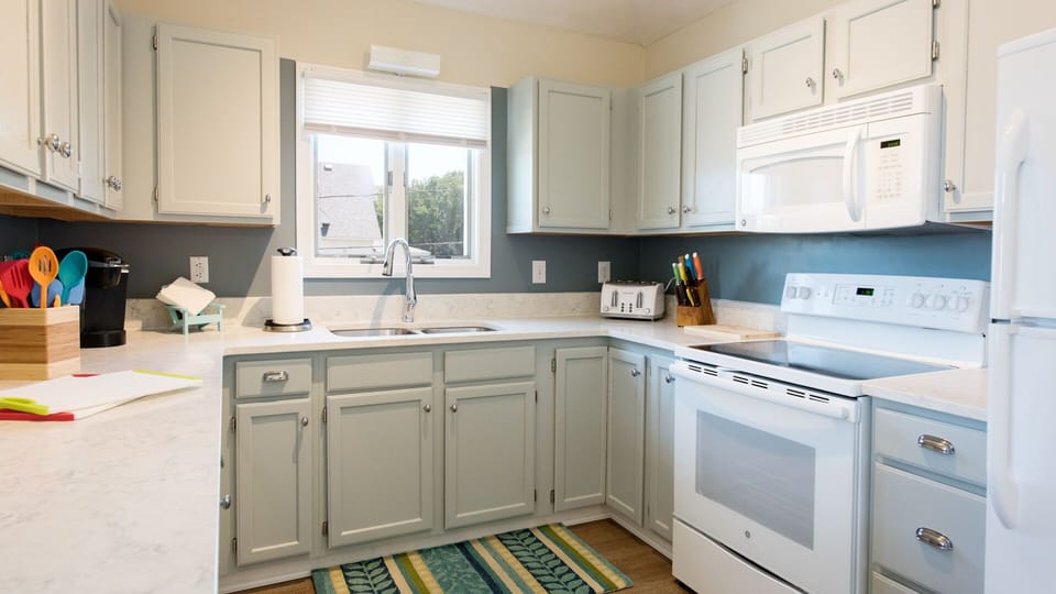 Bright, well-stocked kitchen with lots of counter space.