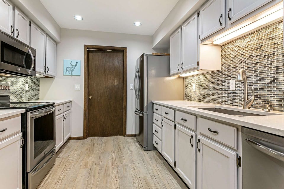 The full size washer and dryer and garage entrance are located just out the kitchen door.