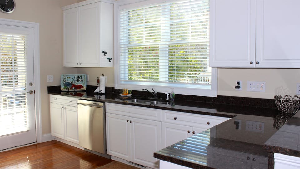 Bright and sunny well stocked gourmet kitchen.