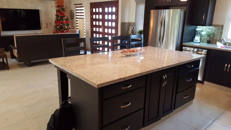 large central kitchen island for work and dining