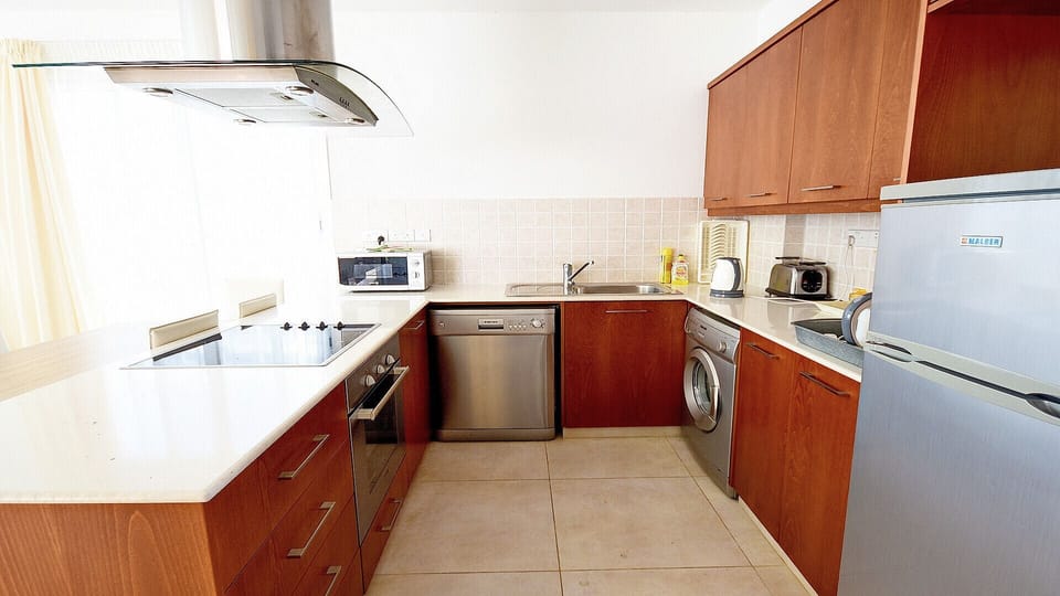 Kitchen is equipped with the expected utilities including fridge, freezer, cooker, oven, microwave, kettle and toaster.