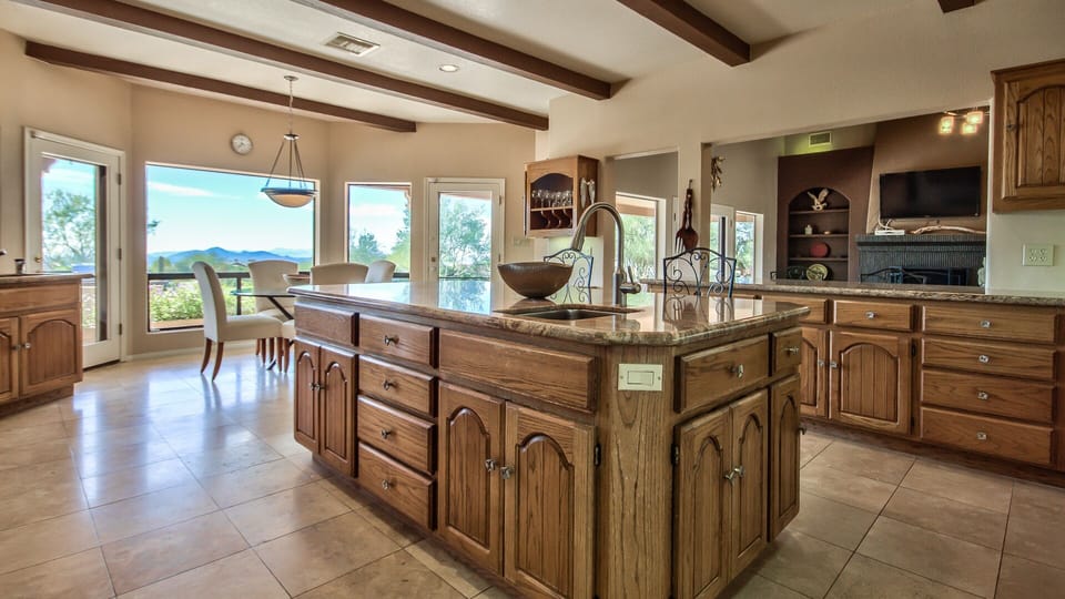 Kitchen with large island and room for the whole family to gather.