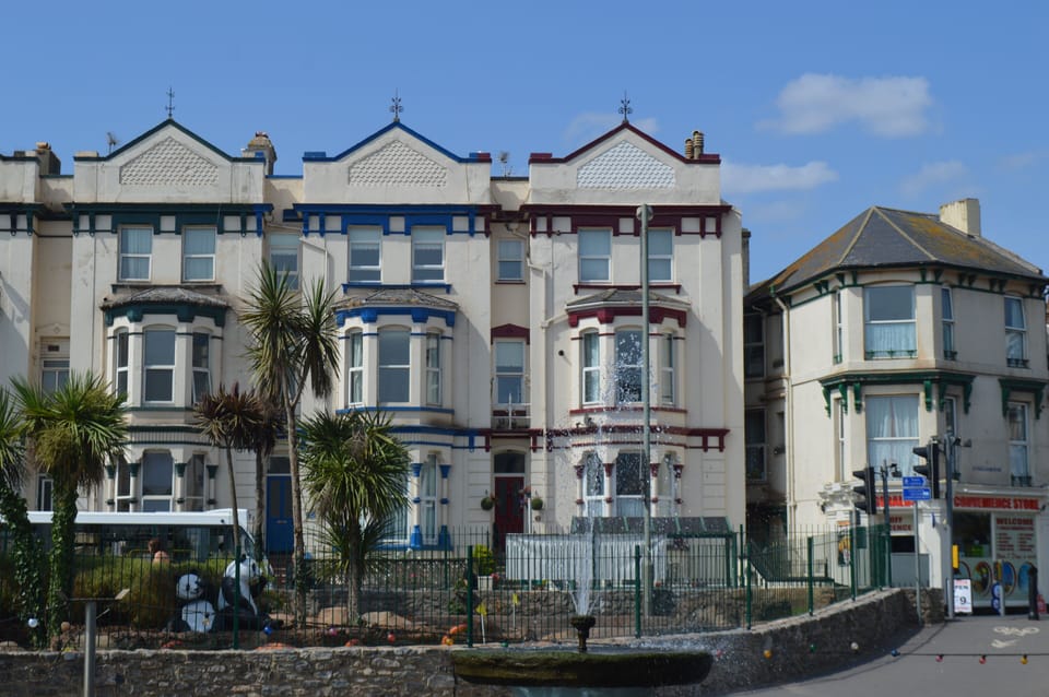 The Front of the Property. Mead Flat is the top 3 windows of the middle house.