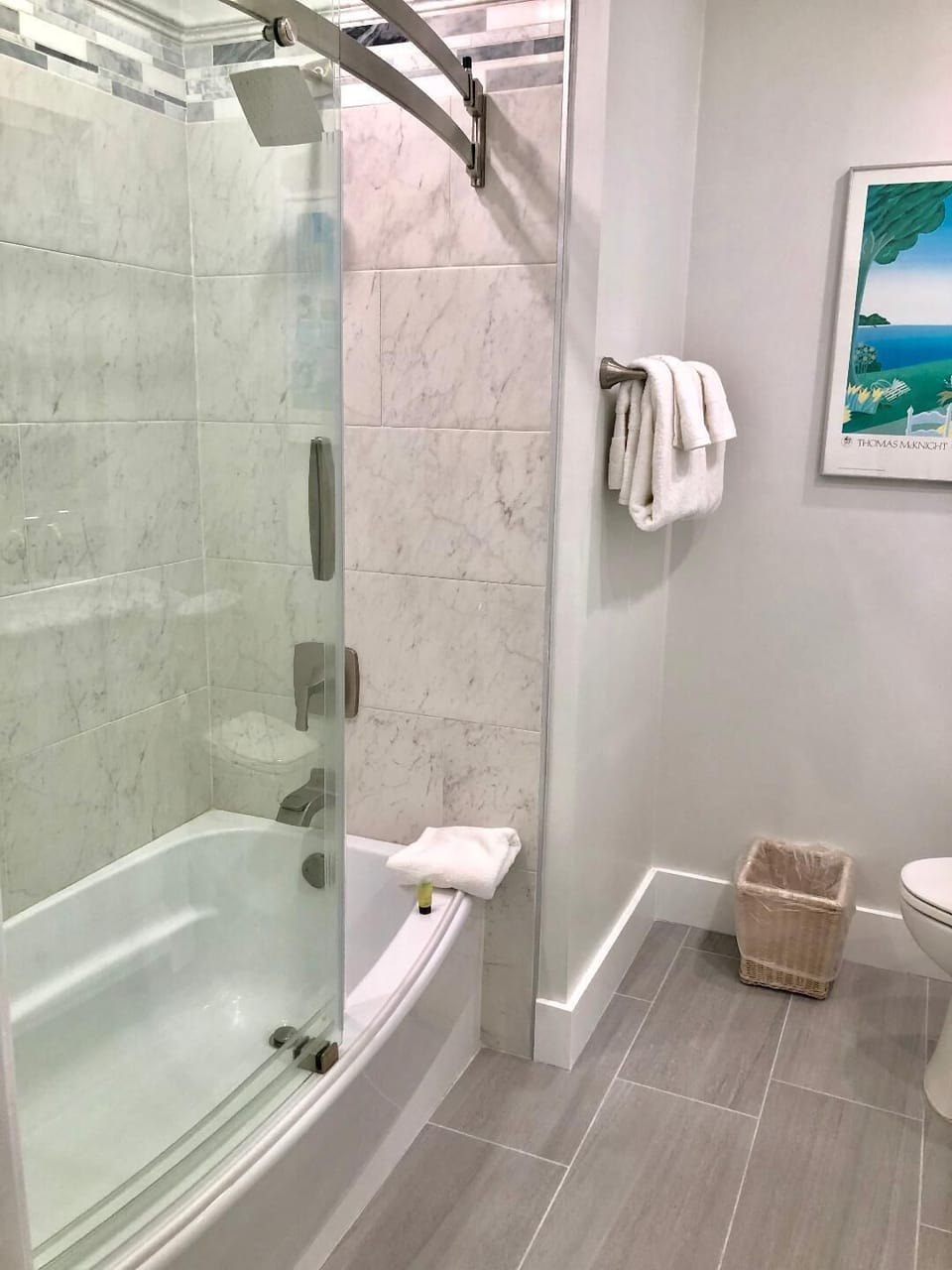 Shower/tub combination in the downstairs bathroom shared by Bedroom 1 and 2.