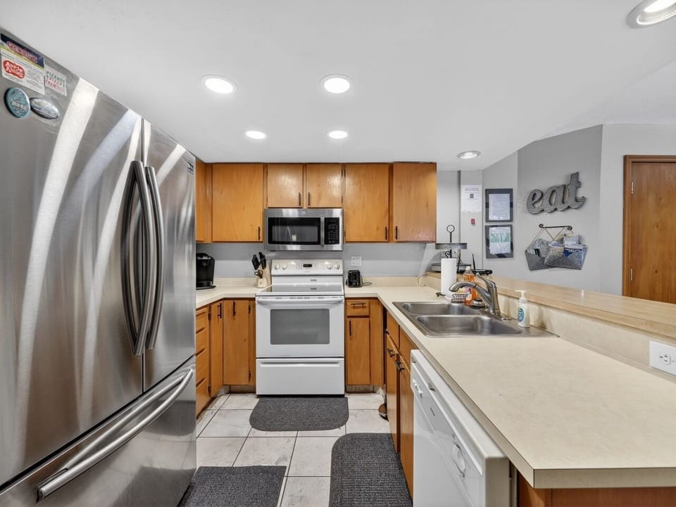 Your fully equipped kitchen features modern appliances and ample counter space for preparing memorable meals during your stay.