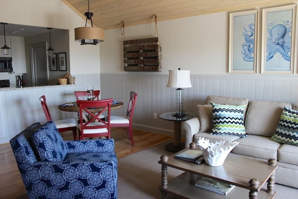 The sofa opens into a queen bed for your guests. Doors allow access to the deck.