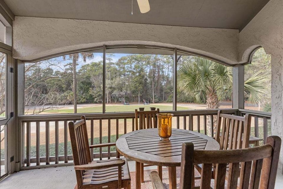 The screen porch off the living room has a table for dining