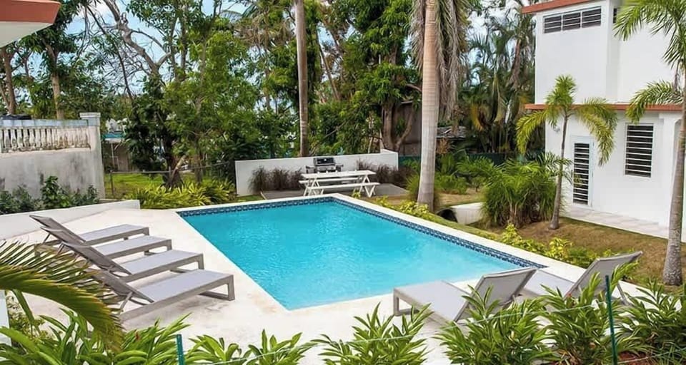 15'x30' Saltwater pool with chaise lounge chairs
