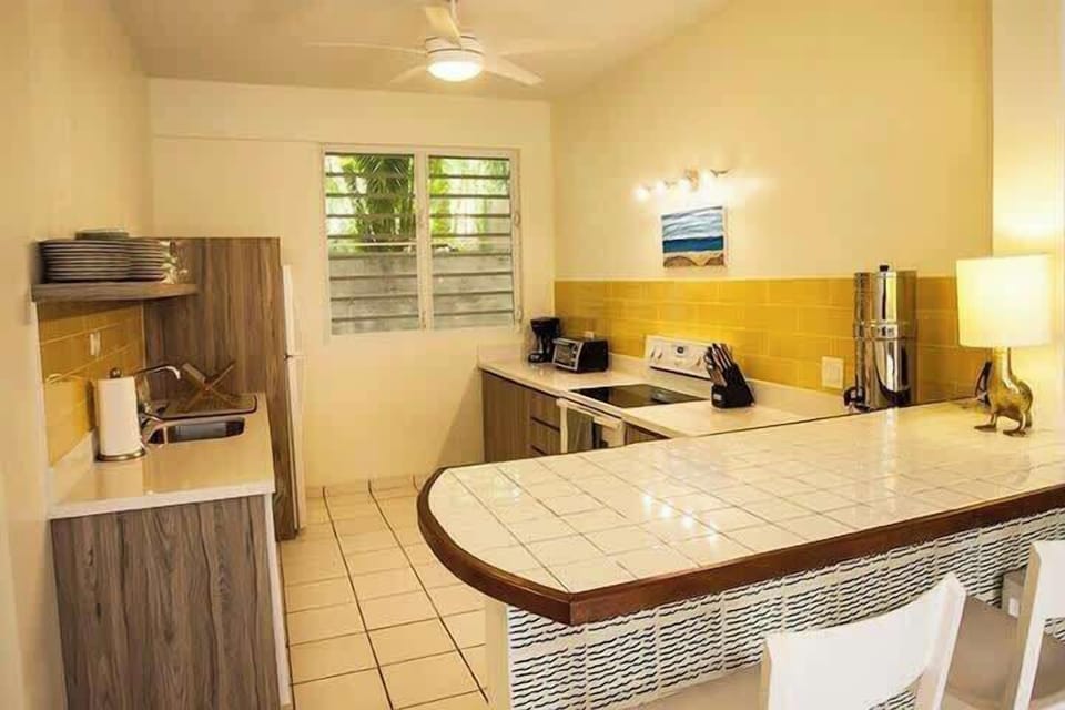 Fully stocked kitchen with fridge, stove dish washer, blender, coffee pot, toaster, spices and water purification system