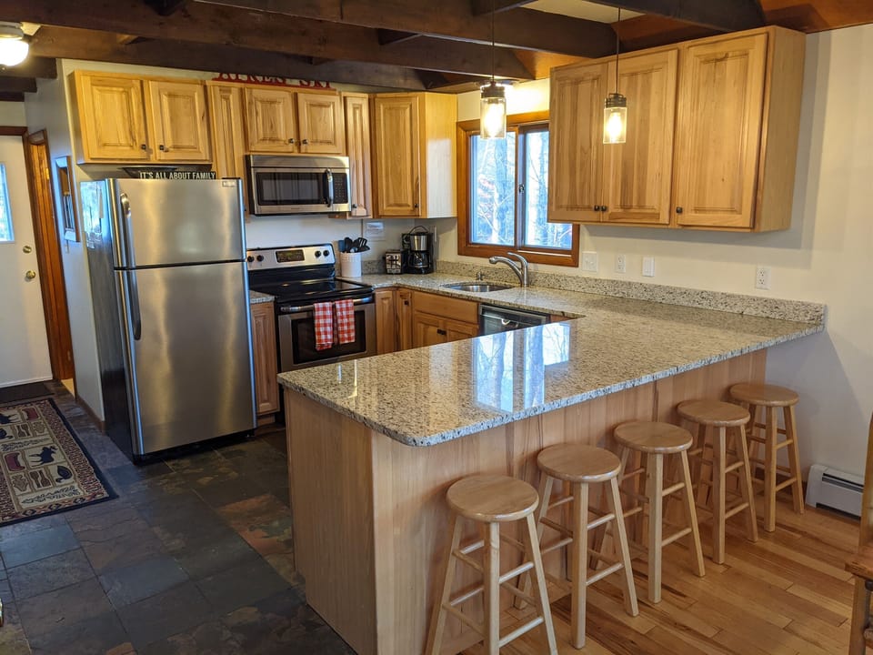 Granite kitchen with bar stools for 5