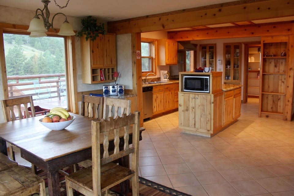View of Kitchen and one dining area, gas stove and double ovens!