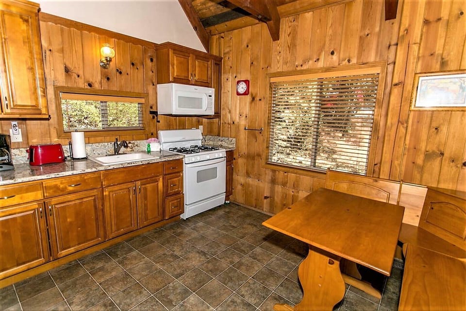 Knotty pine kitchen and dining area