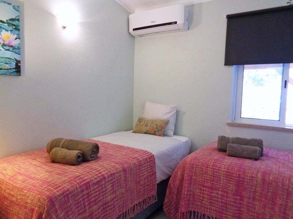 Twin bedroom with views to the back of the house.