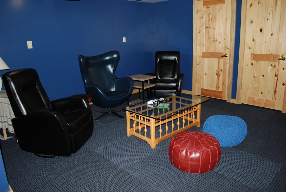 Downstairs MANCAVE, Xbox one, wii game system on 60"
flatscreen TV