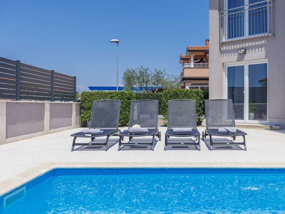 Water, Property, Sky, Plant, Swimming Pool, Azure, Street Light, Outdoor Furniture, Shade, Condominium
