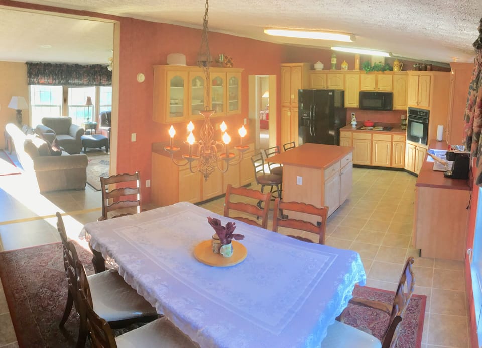Large eat-in kitchen with breakfast bar and dining room