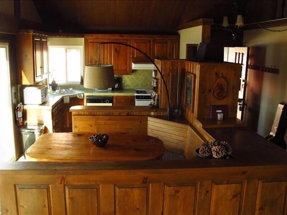 Kitchen and booth flow together for easy access eating for large groups