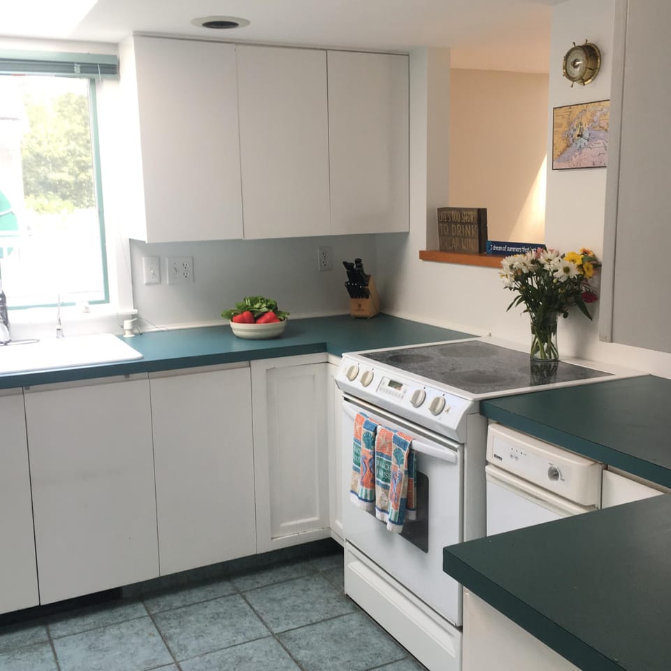 Large stocked kitchen with water views