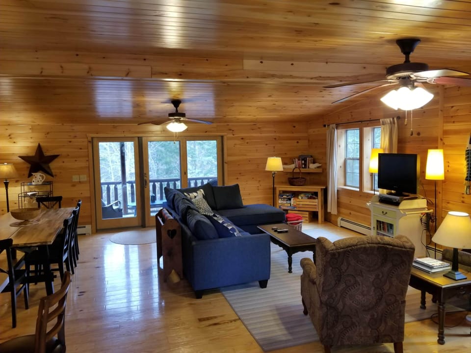 Great room with living and dining area; entry view next to kitchen