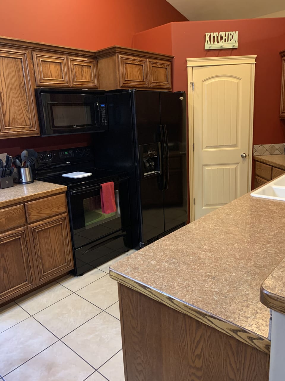 Stocked kitchen with dishwasher and large pantry 