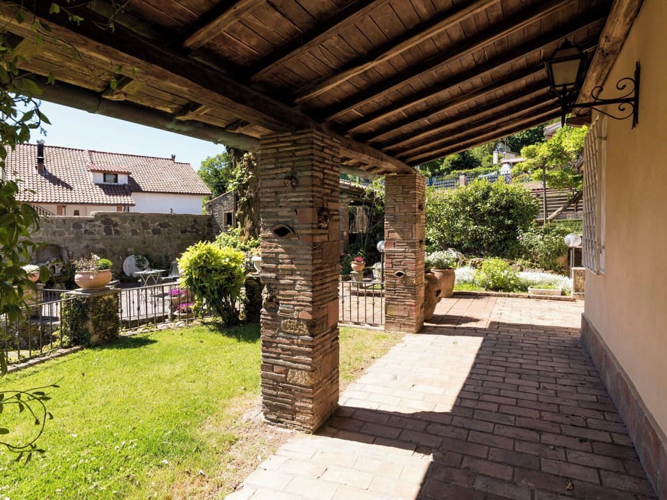 Flowerpot, Brick, Flagstone, Garden, Shade, Houseplant, Outdoor Structure, Brickwork, Landscaping