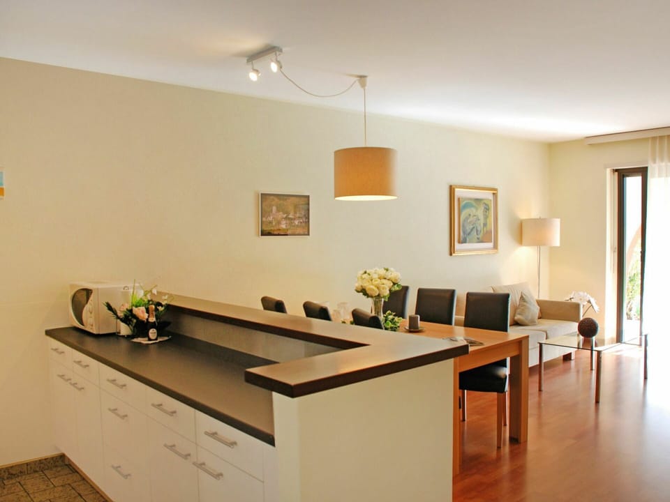 Furniture, Table, Houseplant, Cabinetry, Wood, Orange, Interior Design, Lighting, Desk, Picture Frame