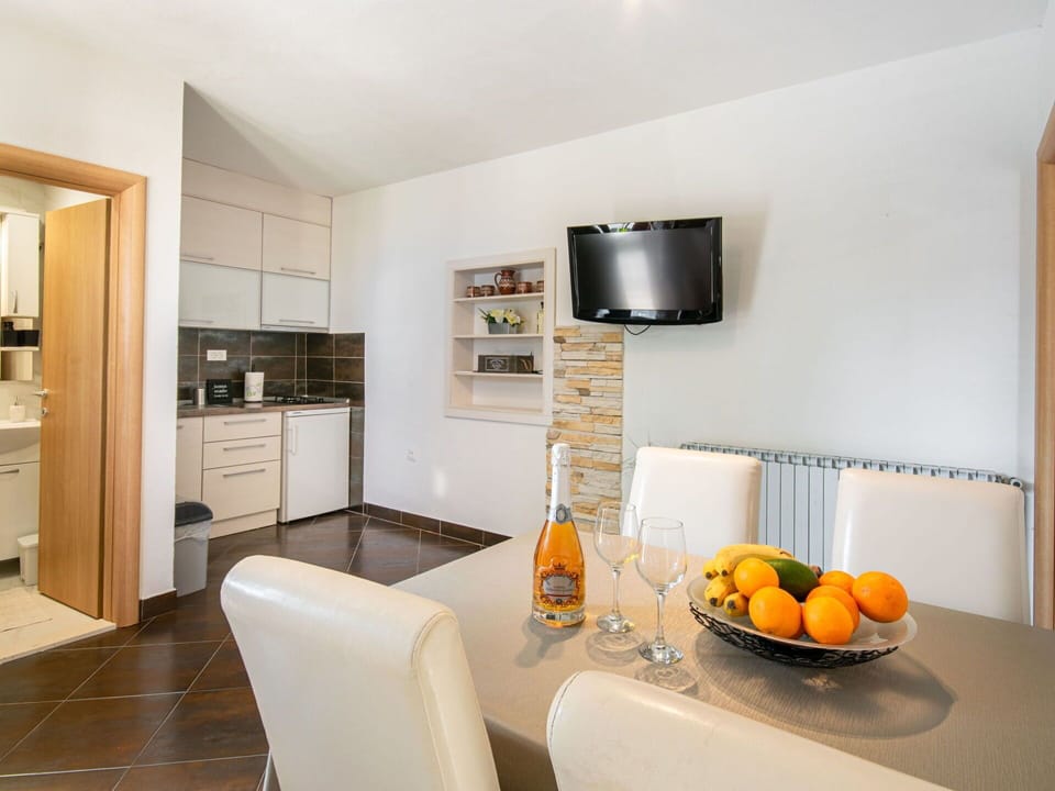 Property, Cabinetry, Table, Lighting, Interior Design, Wood, Orange, Flooring, Floor