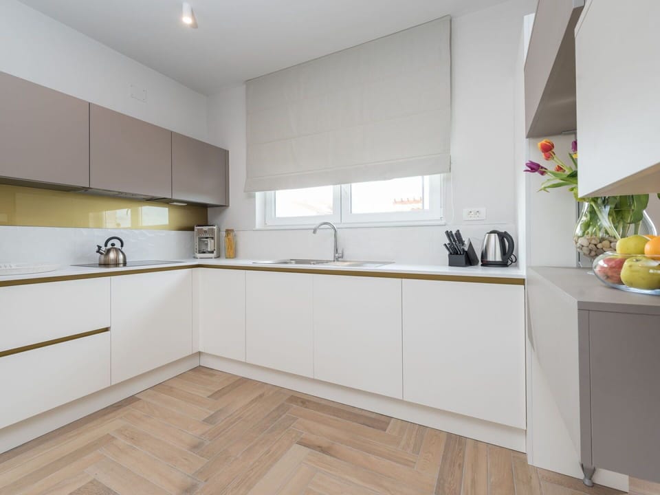 Room, Property, Countertop, Kitchen, Cabinetry, Furniture, Interior Design, Floor, Yellow, Building