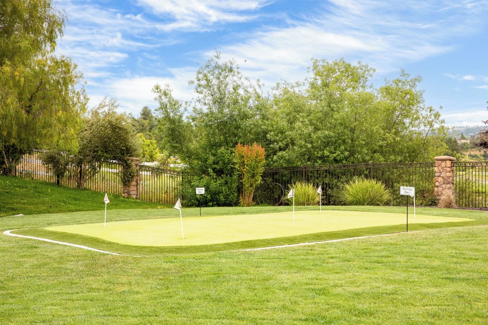 Private backyard putting green to practice your swing.