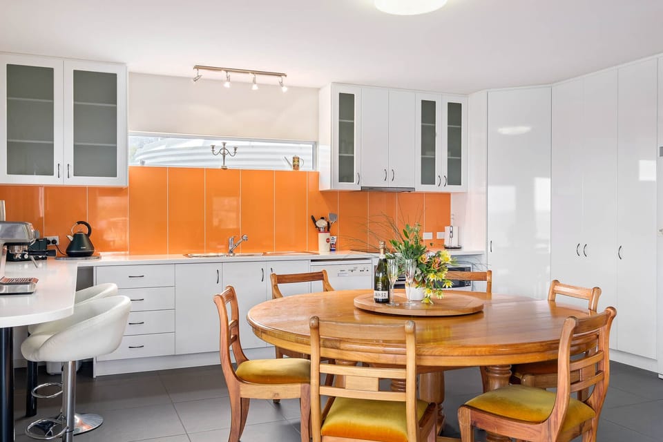 Fully equipped kitchen with cooking amenities and complete dinnerware