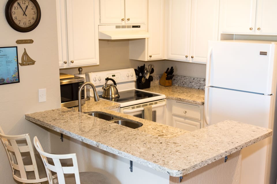 New quartz counter tops, all kitchen utensils available to cook your meals.