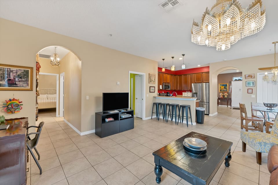 View of great room, kitchen, bedroom 2 and entrance. View door open laundry room