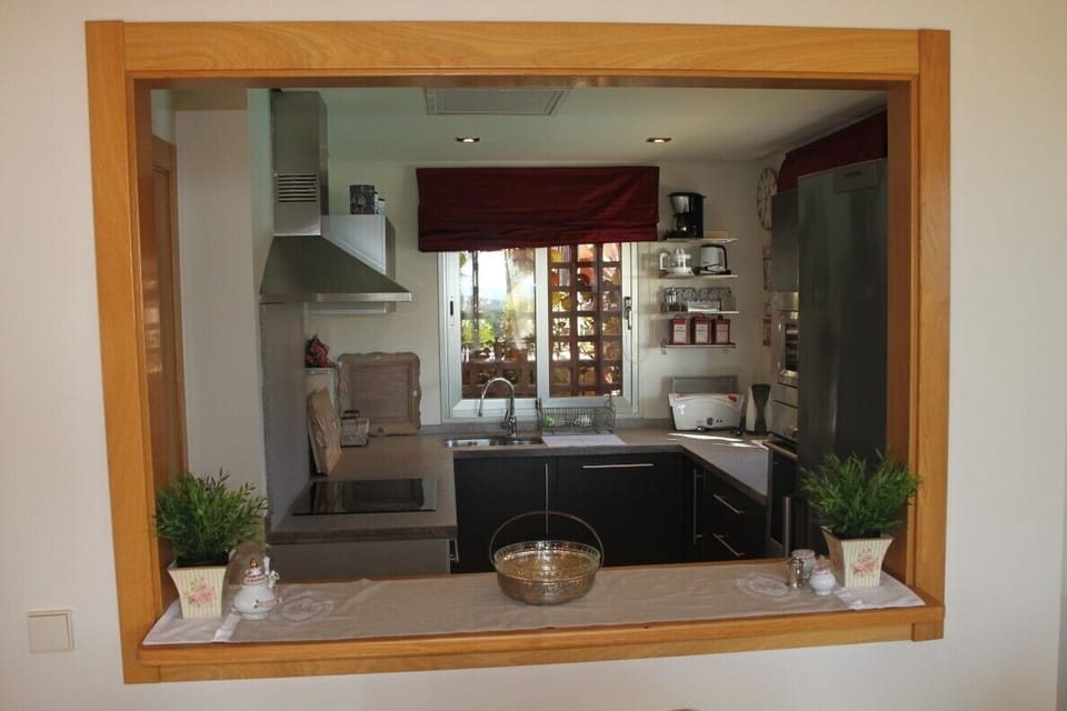 Kitchen with corridor to dining area