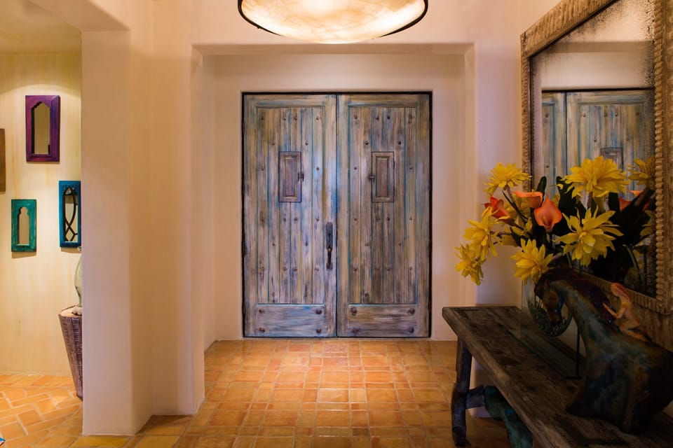 Artist painted doors and ceiling murals in entrance