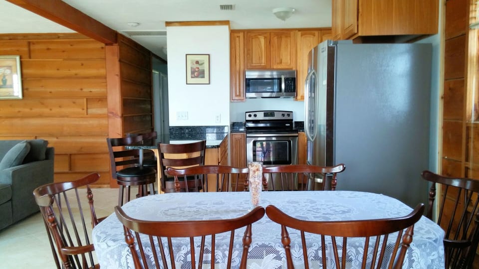Kitchen with new stainless steel appliances , toaster oven, coffee maker, microw
